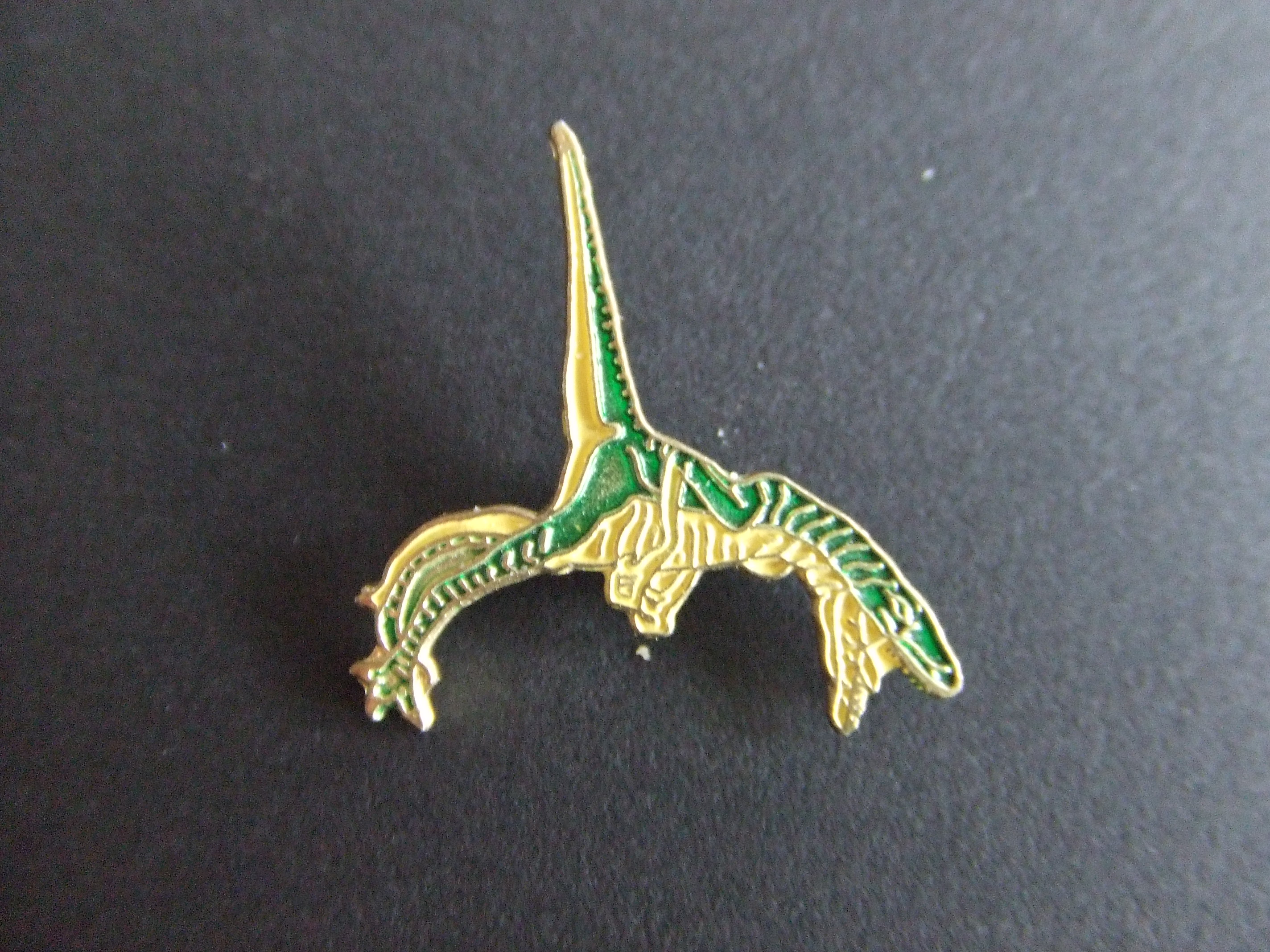 Dinosaurus groen geel staart omhoog